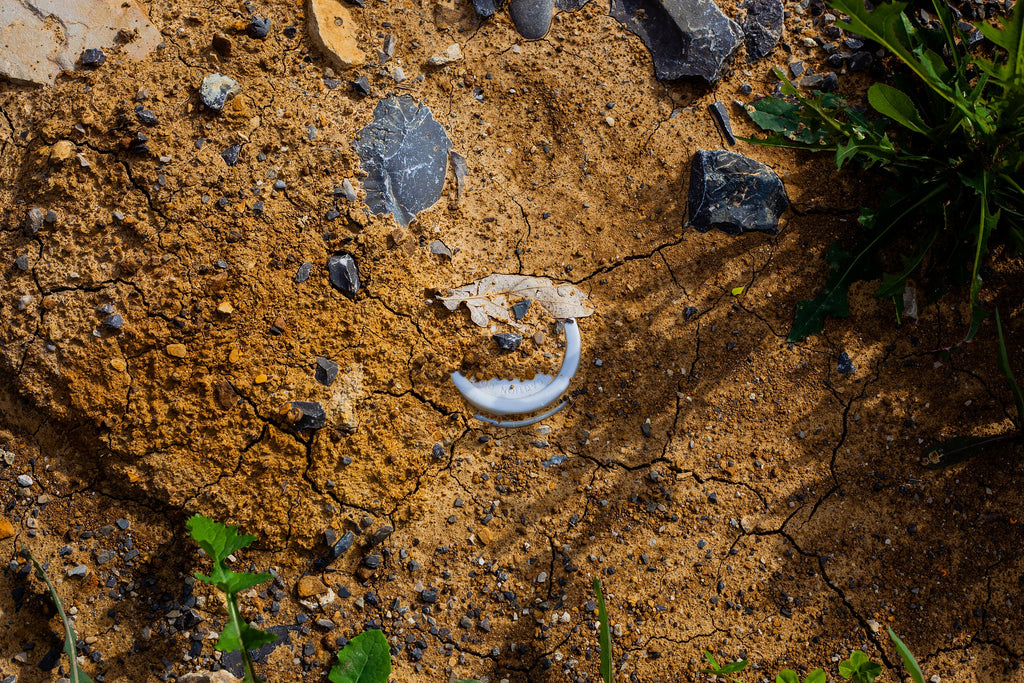 Coffee capsule in the ground polluting the soil. 
