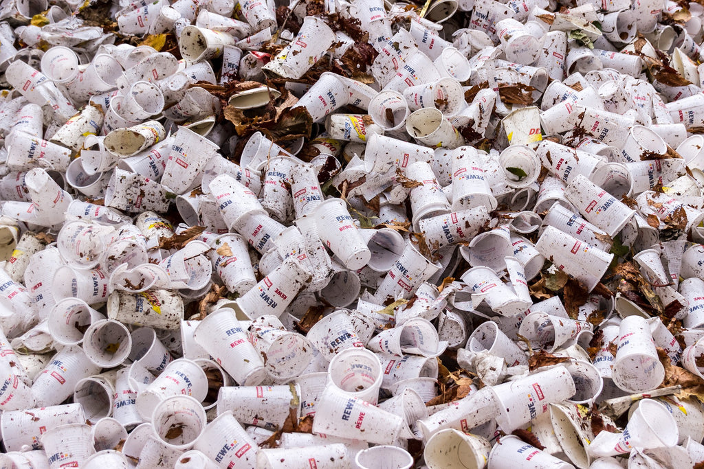 Many plastic disposable cups are filling up the landfill. 